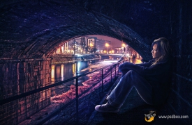 Photoshop合成灯火中桥洞独坐的美女